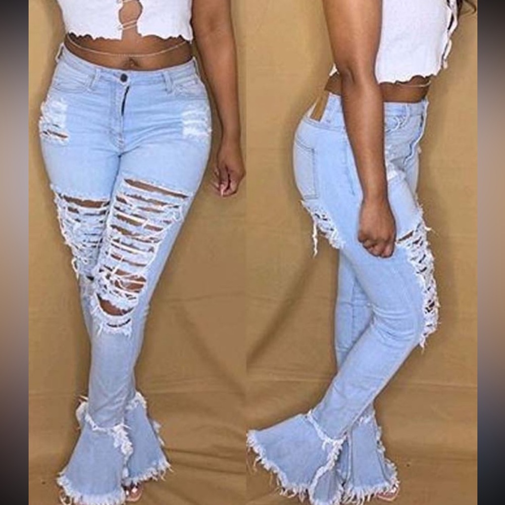 Distressed flared jeans. Light wash with stretch.